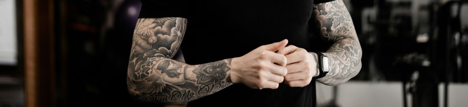 a man arm with tattoo sleeve