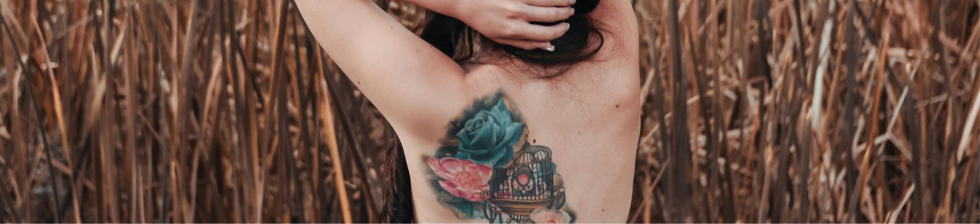 a naked back of a woman with temporary tattoo