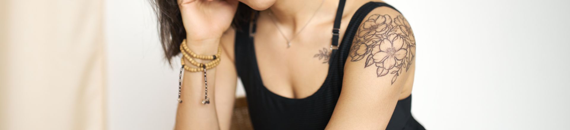 a woman wearing own design temp tattoo on her arm