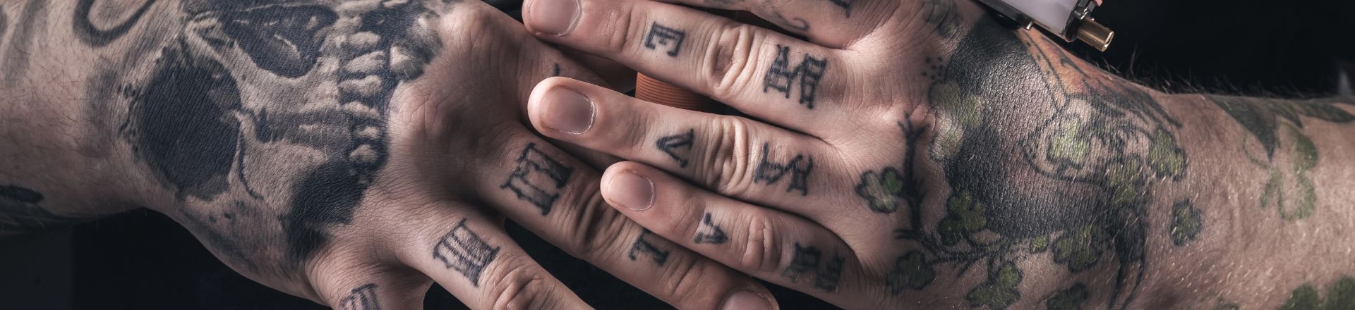 a man's hand covered in temporary hand tattoos