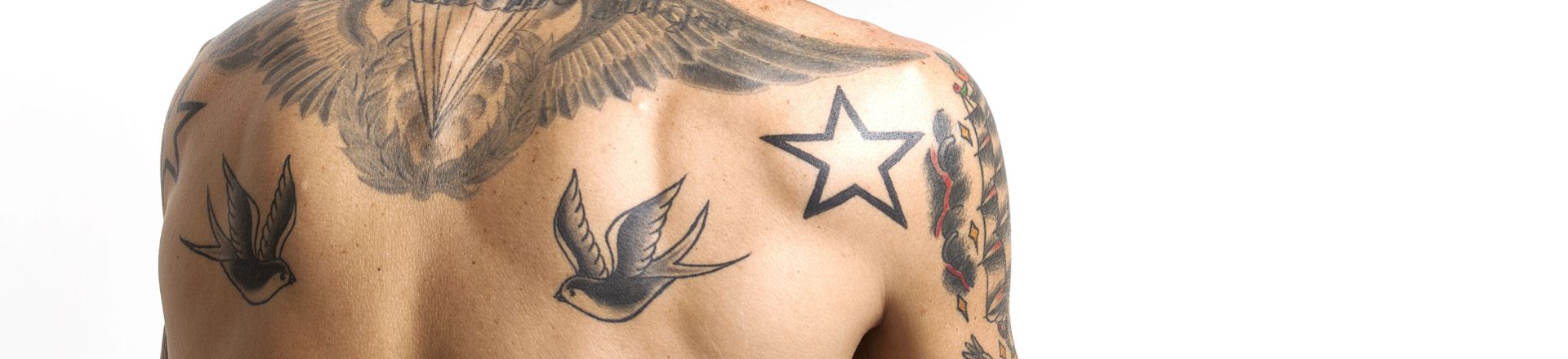 Handsome and sexy tattooed man closeup back portrait