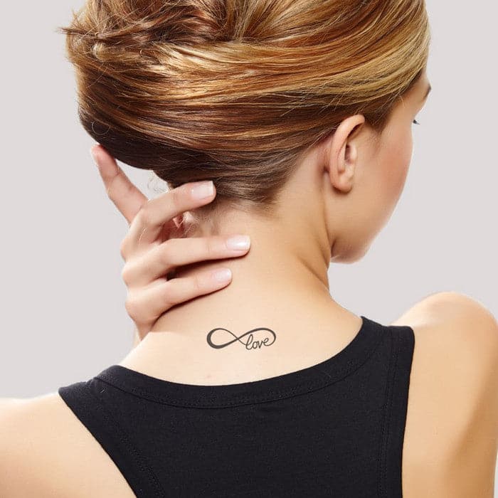Side tattoo of a infinity heart on Crystal Lynn.