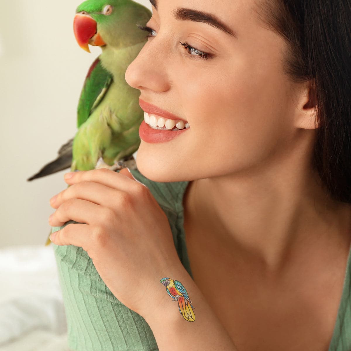 Tattoo of Lucy's parrots, Coco and Skittles, on her arm. Thanks again. Best  picture I could get, a little irritated after a long session | Instagram